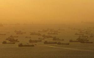 Shipping vessels and oil tankers line up on the eastern coast of Singapore in this July 22, 2015 file photo. REUTERS/Edgar Su/Files